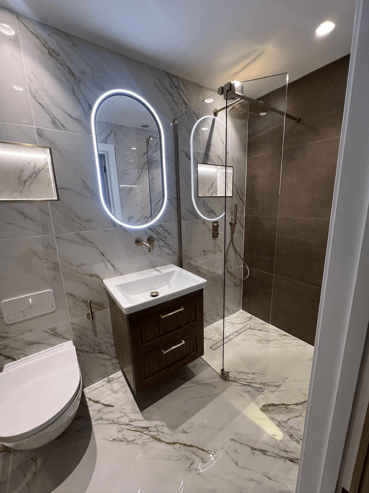 Marble bathroom with LED mirror and walk-in shower